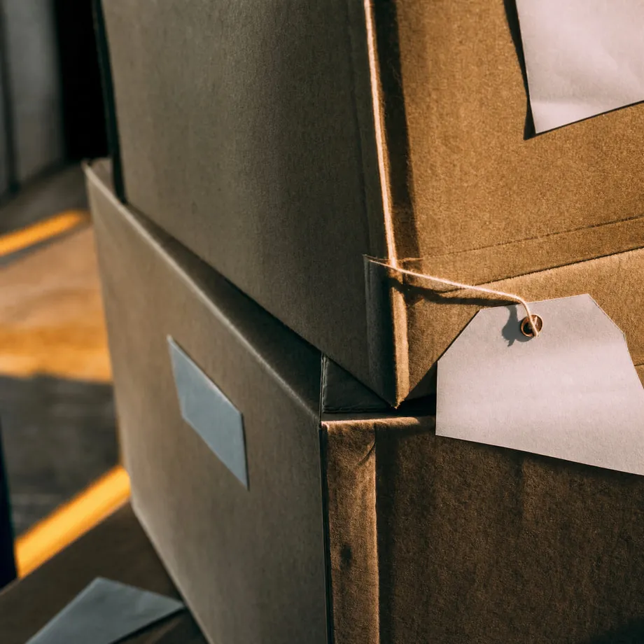 Stacked pallet labels and shipping tags in close detail.